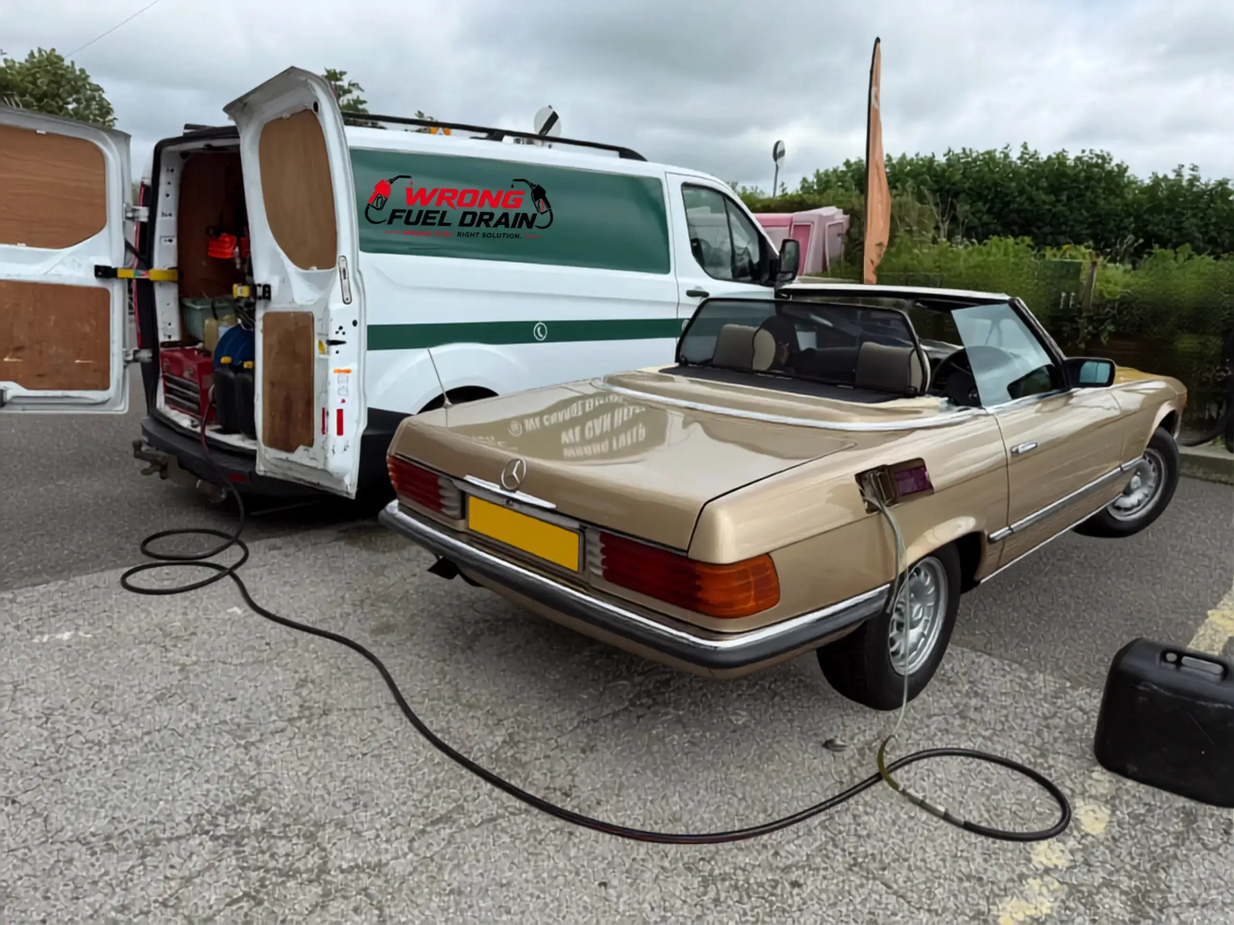 Petrol in diesel fuel drain on a Mercedes at the roadside